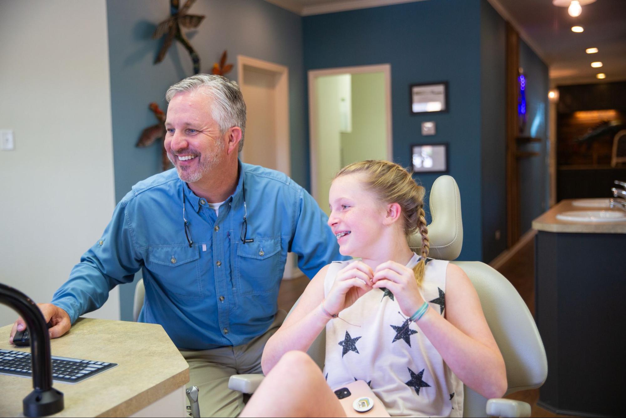 woman shaking dr. williams hand during appointment