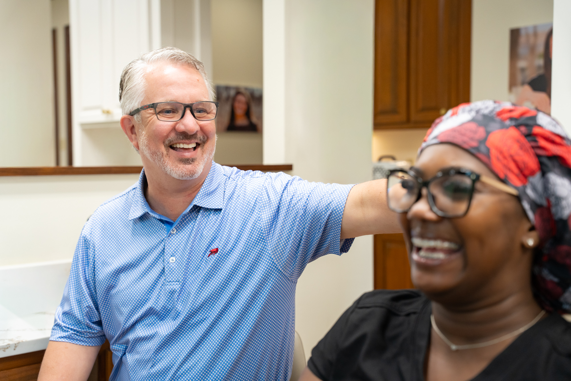 young patient smiling with doctor during visit